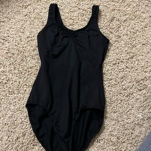 Leotard with pinched front.